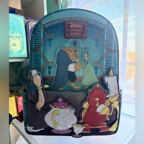 disney beauty and the beast library scene mini backpack Mini-Backpack Belle and the Beast dance while Fifi (the feather duster) Disney Loungefly Mini Backpack -